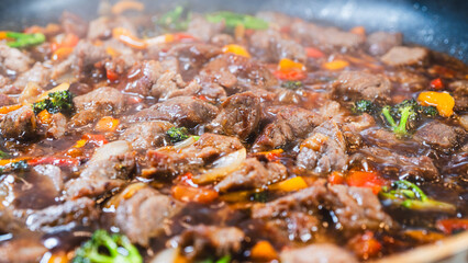 Beef cubes with broccoli, onions, and bell peppers bubbling in savory soy sauce. Smoking hot, perfect for rice bowls or main dish.