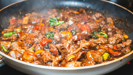 Beef cubes with broccoli, onions, and bell peppers bubbling in savory soy sauce. Smoking hot, perfect for rice bowls or main dish.
