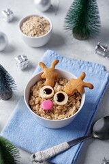 Oatmeal in a bowl in the form of reindeer for Christmas holidays