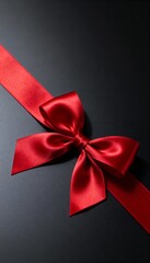 Red satin ribbon bow tied on a dark minimalist background, showcasing a refined gift wrapping detail ideal for Christmas promotions, romantic occasions, and elegant decorative themes.
