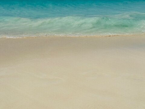 Turquoise water on a sandy beach, Eagle Beach, Aruba - Powered by Adobe