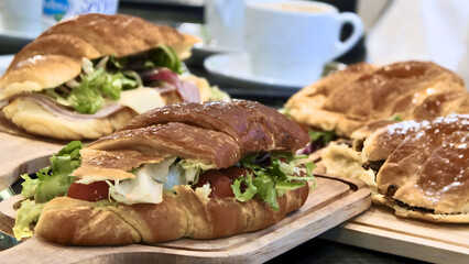 Roast beef sandwich with fresh vegetable salad, gourmet meat lunch on a white plate