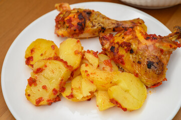 Fried Chicken with Potatoes on White Plate