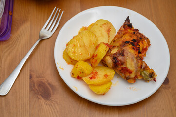 Appetizing Fried Chicken with Potatoes on Plate