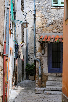 Fototapeta Typical narrow street of old mediterranean town. Historic city of Vence, France