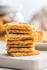 Crunchy salted crackers on whiten table.