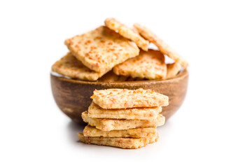 Crunchy salted crackers in bowl  isolated on white background.