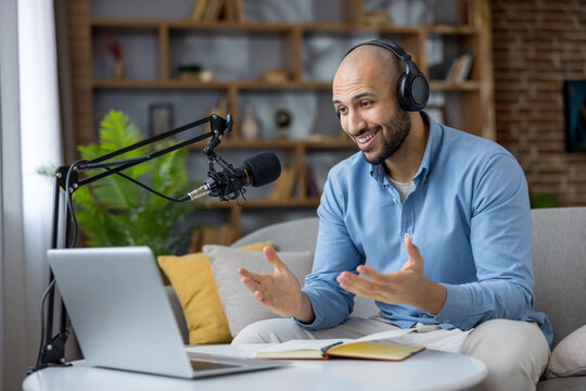 Young man creating podcast episode from home studio