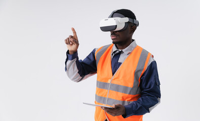 African male adult engineer with tablet computer using vr headset for virtual training in safety vest