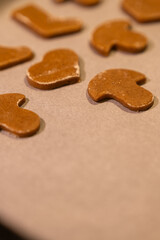 Vertical Gingerbread Hearts, Mushrooms and Boots on Baking Paper – Half Frame Detail