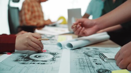 A dynamic team engages in a collaborative meeting, bringing together diverse skills and ideas to strategize and plan for upcoming projects in a modern office setting. SACTR
