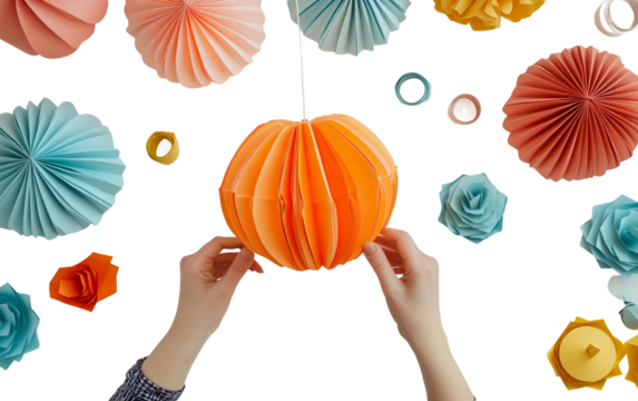 Person folding handmade paper lanterns in a workshop scene with detailed attention to craftsmanship and design isolated on transparent background PNG