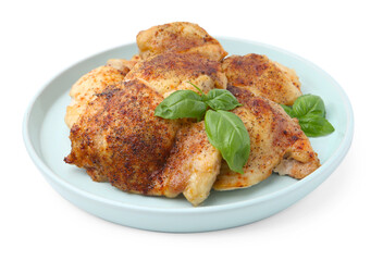 Tasty roasted chicken thighs with basil isolated on white