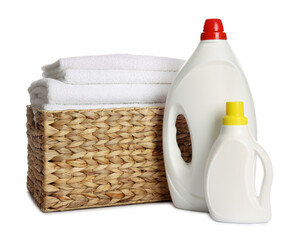 Laundry basket with clean towels and detergents isolated on white
