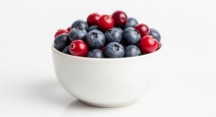 Bowl of blueberries and cranberries on a white background