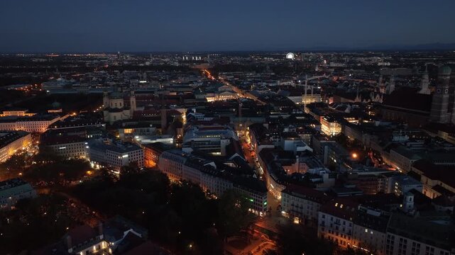 night time illumination munich city center aerial panorama 4k germany