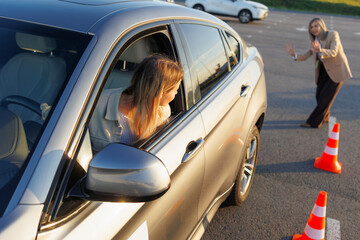 Driving Examiner Completing Evaluation Form Inside Vehicle