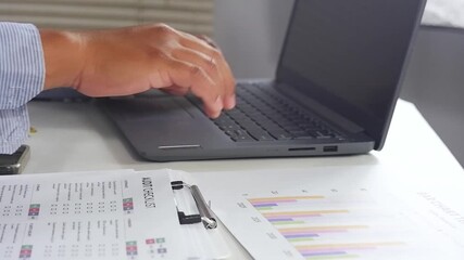 Businessman typing on laptop, working on laptop, man typing email on laptop, writing blog. Social networking, freelance, laptop in cafe. Finance, technology and industry concept footage. - Powered by Adobe