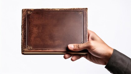 hand holding an old weathered leather bound book isolated on white background hand holding closed book mockup isolated on white background
