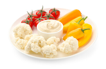 Different fresh vegetables and sauce isolated on white