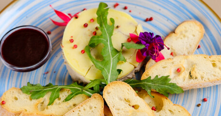 Chicken liver pate with crunchy baguette and fruit jelly sauce isolated on white background. Delicious duck or goose liver spread or foie with croutons on elegant restaurant plate top view.