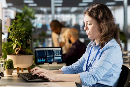 Young worker conducting financial planning with analytics and setting goals, demonstrating expertise in business administration. Woman analyzing online reports and forecasts to drive company growth. - Powered by Adobe