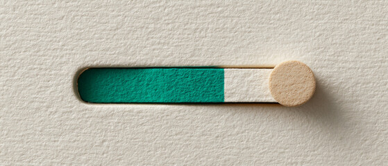 Close-up of a textured progress bar with a green fill and a circular slider on a beige paper background