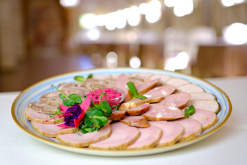 Grilled meat assortment platter in bright sunlight, overhead composition with rustic table setting. High quality photo