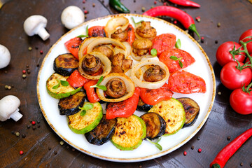 Delicious grilled vegetables on plate on table close-up. High quality photo