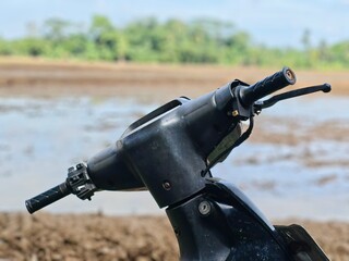 a black motorbike handlebar, this is one of the old motorbikes in Indonesia