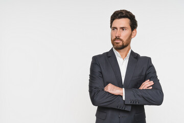 Confident business man company owner entrepreneur serious professional executive manager businessman leader looking on copy space standing arms crossed isolated white studio background portrait