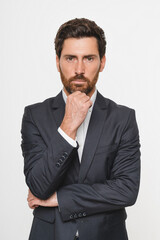 Vertical shot of Confident business man company owner entrepreneur serious professional executive manager businessman leader looking at camera standing arms crossed isolated white studio background