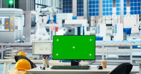 Green screen PC display in photovoltaics factory used to monitor performance during solar panels manufacturing. Mockup computer in empty facility used to inspect solar plant machinery, panning shot