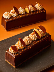 Elegant Chocolate Cakes with Whipped Cream and Biscuit Toppings on Orange Background