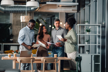 Diverse business team collaborating in modern office