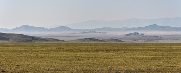 Wide steppe landscape with mountains