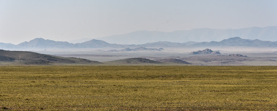Wide steppe landscape with mountains