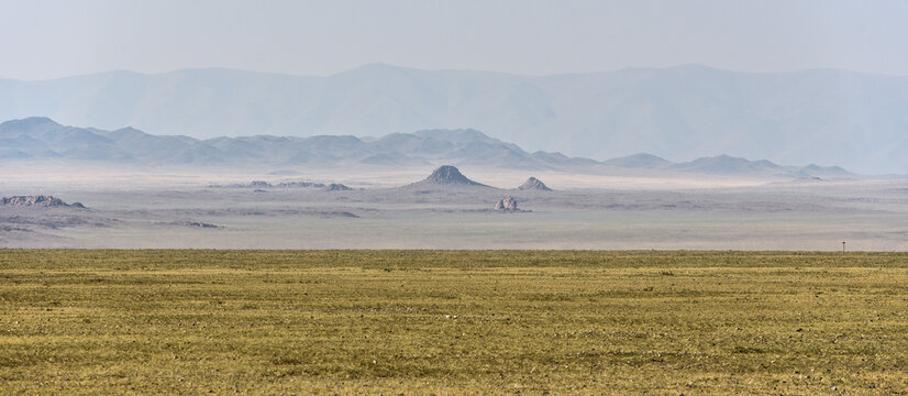 Wide steppe landscape with rocks