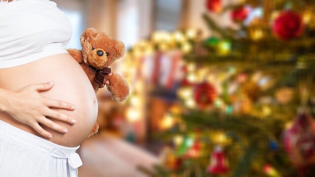 Pregnant woman on christmas background