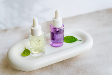 Bakuchiol face serum in a glass bottle on shadows background 