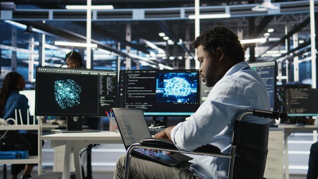 Server room admin with disability interprets machine learning generated data analytics graphs. IT professional in inclusive data center using artificial intelligence showing system metrics, camera A - Powered by Adobe