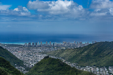 Pālolo Valley with the city skyline of Honolulu. Mauʻumae Ridge Trail (Puʻu Lanipō), Oahu, Hawaii. Koʻolau Range, shield volcano. On the right is Waʻahila Ridge
