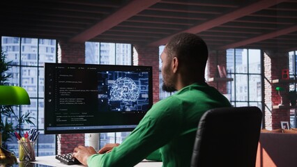 Fototapeta premium Black tech engineer programming an AI brain neural network for machine learning, doing maintenance and debugging the software systems. Technician expert uses coding language. Camera B.