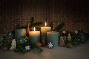 Two candles are lit for second Advent, fir branch, cinnamon star cookies and natural Christmas...