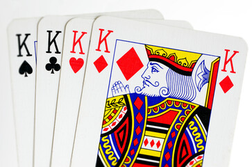 King cards isolated on white background.A standard deck of playing cards contains four kings: the King of Spades, King of Hearts, King of Diamonds, and King of Clubs.