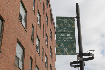 Fototapeta premium hanging banner for The Eglinton Way BIA a neighbourhood shopping area, Toronto
