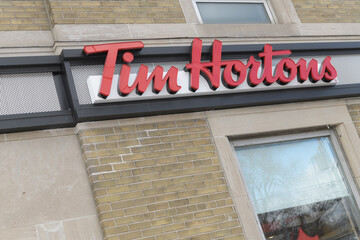 Fototapeta premium exterior building and sign of Tim Hortons, a coffee shop chain, located here at 878 Eglinton Av E, Toronto