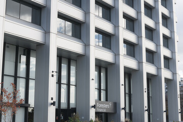Fototapeta premium abstract architectural facade and sign of Foresters Financial, an insurance agency, located at 789 Don Mills Rd, Toronto