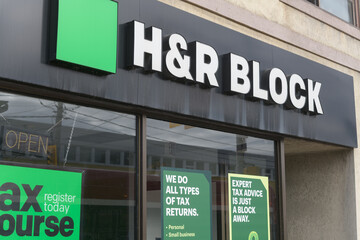 Fototapeta premium exterior building facade and sign of H&R Block, tax preparation service, located at 1952 Eglinton Av W, Toronto