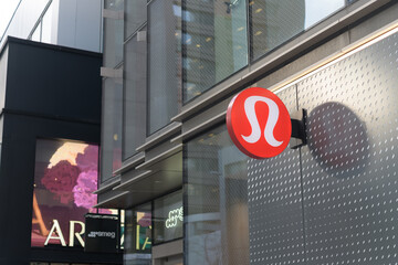 Fototapeta premium projecting logo sign outside lululemon, an overpriced sportswear store, located at 2 Bloor St W, Toronto